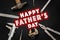 Happy father`s day text sign on working tools hammer wrench plie