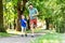 Happy father and son compete in running at park