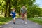 Happy father and son compete in running at park