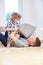 Happy father and son making pillow fight