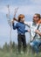 Happy father and son planted a tree together.