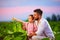 Happy father and son on their tobacco plantation, at sunset