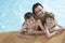 Happy Father With Sons In Swimming Pool