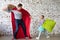 Happy father in superhero costume and his daughter
