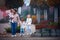 Happy father with three children walking down the street