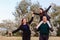 Happy father and two daughters in the summer on a walk