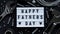 Happy Fathers Day banner concept.Working repair tools upholstery stapler,screwdriver,screws,adjustable wrench,duct tape and light