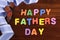 Happy Fathers Day childrens toy block colorful letters spelling greeting