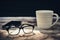 Happy fathers day concept. coffee cup with black paper mustache, glasses on wooden table