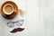 Happy Fathers Day concept. Cup of coffee, label with text Happy Father`s Day, glasses and mustache on wooden table. Flat lay, top