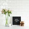 Happy Fathers Day concept. Letterboard with sign Happy Father`s Day, gift box, boquet of flowers, coffee cup on table. Tile wall