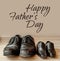 Happy fathers day, fathers shoes and baby boys shoes overhead, flat lay