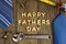 Happy Fathers Day on wood with tools and ties