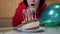 Happy Female Blows Out Candles on a Birthday Piece of Cake. Slow motion