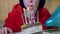 Happy Female Blows Out Candles on a Birthday Piece of Cake. Zoom. Close up