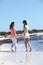 Happy Female Buddies Enjoying at the Beach