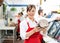 Happy Female Butcher Holding Large Ham