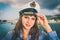 Happy female captain with sailor cap