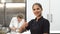 Happy female chef smiling showing thumbs up at the kitchen