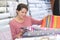 Happy female customer inside textile store