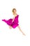 Happy female dancer in pink jumping