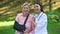 Happy female doctor hugging aged lady in shoulder immobilizing sling, health