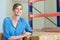 Happy female employee smiling in warehouse