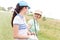 Happy female golfers talking at golf course