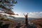 Happy female hikerat the summit of an Appalachian mountain