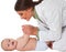 Happy female pediatrician playing with toddler