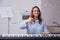 The happy female pianist gives a thumbs up sign of approval