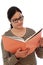 Happy female student holding text book against white