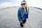 Happy female tourist explores the beach of Assateague Island National Seashore