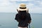 Happy female tourists She stands at the landmark of Phuket sea, Enjoy the Sunset view at Laem Phromthep