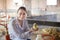 Happy female veterinarian holding duckling