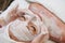 Happy female with white facial mask in spa treatment alternative medicine