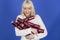 Happy Festive Young Woman Holding Christmas Crackers