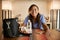 Happy filipina nurse at home packing lunch portrait