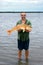 Happy fisherman with big golden fish Red drum Sciaenops ocella