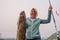 Happy Fisherwoman holding big arctic cod. Norway happy fishing. Woman with cod fish in hands