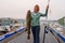 Happy Fisherwoman holding big arctic cod. Norway happy fishing. Woman with cod fish in hands