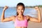 Happy Fitness Woman Flexing Muscles On Beach -