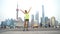 Happy fitness woman jumping in Shanghai skyline