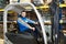 Happy forklift worker at warehouse