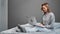 Happy freelancer woman chatting use laptop sitting on comfortable bed. Shot with RED camera in 4K