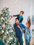 Happy friendly family decorating Christmas tree have fun