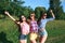 Happy friends in the park on a sunny day . Summer lifestyle portrait of three hipster women enjoy nice day, wearing bright sunglas