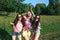 Happy friends in the park on a sunny day . Summer lifestyle portrait of three hipster women enjoy nice day, wearing bright sunglas