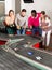 Happy friends play together with slot car racing