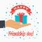 Happy Friendship day - template for greeting card, logo, poster, banner with gift-box in hand palm. Vector.